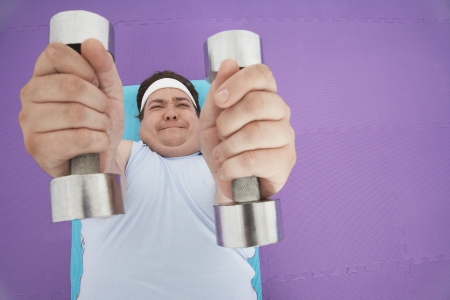 Overweight Man Lifting Weightsの写真素材