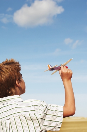 Boy Flying Toy Airplaneの写真素材