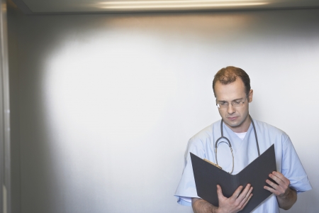 Physician Reviewing Notesの写真素材