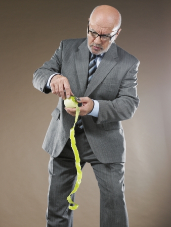 Businessman Peeling Appleの写真素材