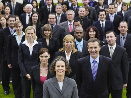 Large group of business people standing on lawn, portrait, elevated view
