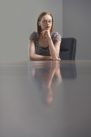 Businesswoman sitting at conference tableの写真素材