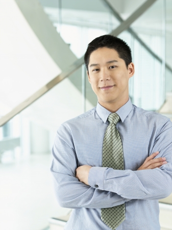 Confident Businessman standing arms crossedの写真素材
