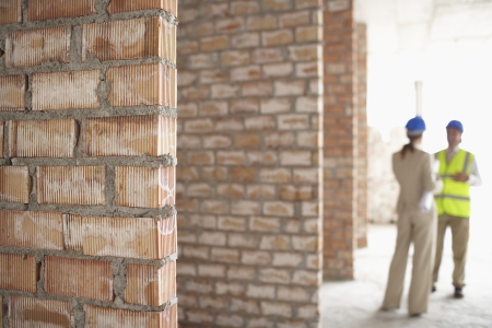 Architect and construction manager on site focus on foregroundの写真素材