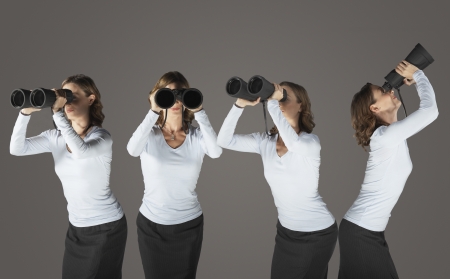 Young woman looking through binoculars standing in various positions digital compositeの写真素材