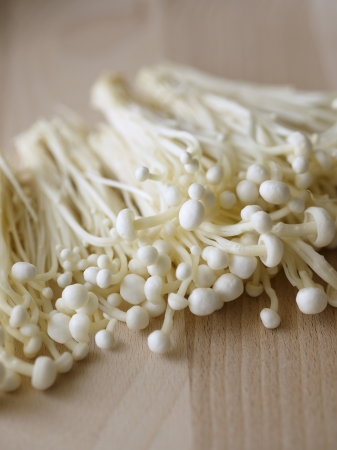 Long thin mushrooms piled togetherの写真素材