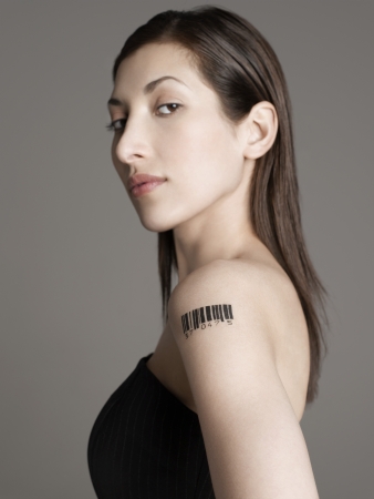 Young woman with bar code tattoo on her armの写真素材