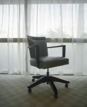 Office Chair in Front of Windowの写真素材