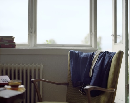 Clothes Draped on Back of Armchairの写真素材