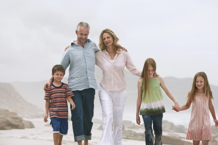 Family Strolling on Beachの写真素材