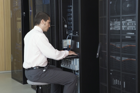 Technician working in server roomの写真素材