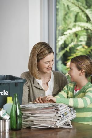 Mother and Daughter Recycling Household Wasteの写真素材