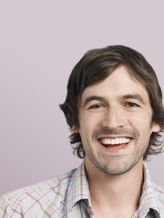 Mid adult man laughing close-upの写真素材