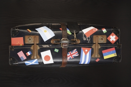 Suitcase with various flag stickers studio shotの写真素材