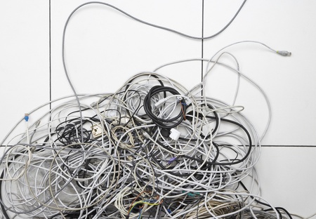 Tangle of computer wires in officeの写真素材
