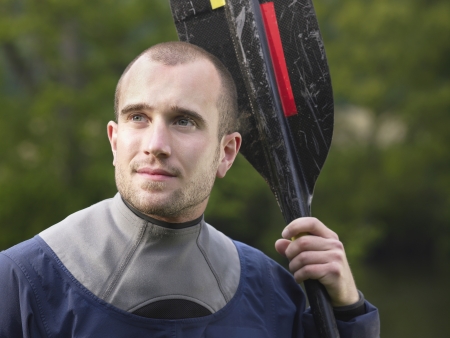 Man with kayak paddle outdoorsの写真素材
