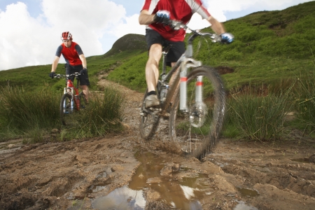 Two cyclists on track in countrysideの写真素材