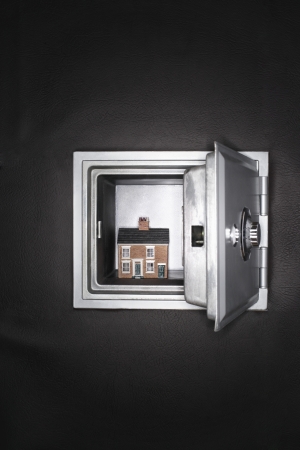 Ceramic house in opened safeの写真素材