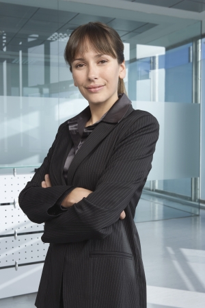 Business woman in office building smiling portraitの写真素材
