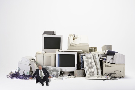 Businessman Next to Old Computersの写真素材