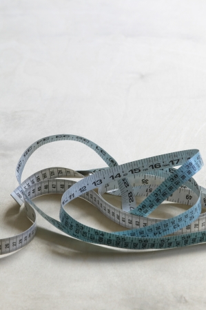 Measuring tape on table elevated view