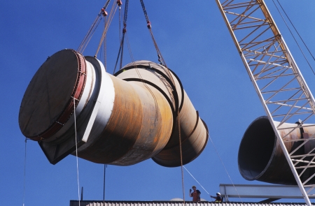 Installing fume extraction pipe into steel foundry smelterの写真素材