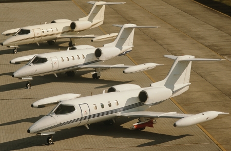 Three jet plains at airport elevated view