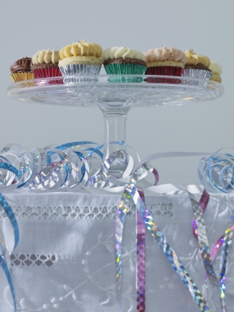 Streamers and cup cakes on table low angle viewの写真素材