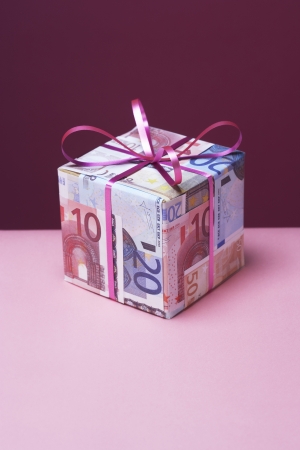 Small gift wrapped in Euro notesの写真素材