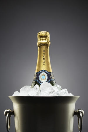 Champagne bottle in ice bucketの写真素材