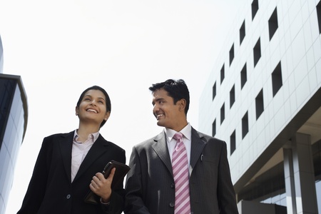 Business man cheering to city back viewの写真素材