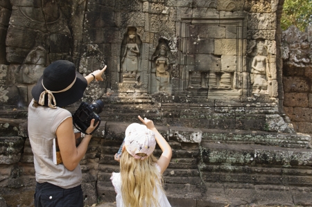 Woman and Girl Looking at Ancient Templeの写真素材