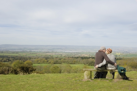 Couple Sitting on a Park Benchの写真素材