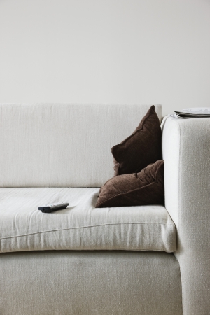 Remote control on sofaの写真素材