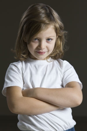 Studio portrait of girl with arms crossedの写真素材