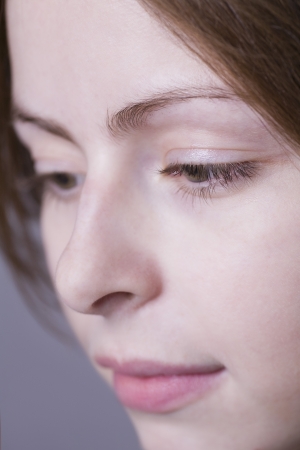 Pensive young woman close-up の写真素材