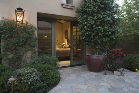 Palm Springs exterior with crazy paving and pot plantの写真素材