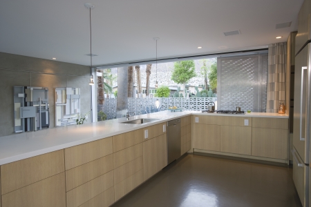 Open plan kitchen furnished in light wood Palm Springsの写真素材