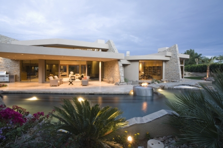 Palm Springs swimming pool and house exterior at duskの写真素材
