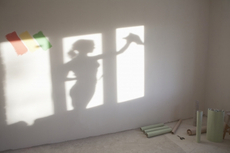 Shadow of woman cleaning windows in new apartmentの写真素材