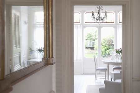 Mirror in hallway with view through to living roomの写真素材