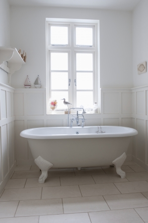Freestanding roll top in panelled bathroom Londonの写真素材