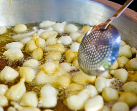 Traditional frying of dough balls (Lokoumathes)  Limassol  Cyprusの写真素材