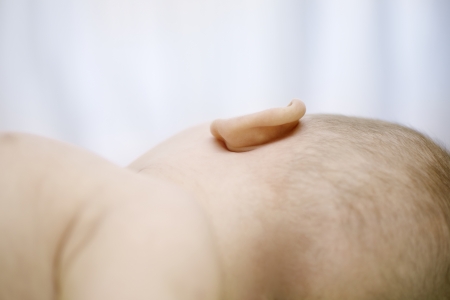 9 month old baby looking awayの写真素材