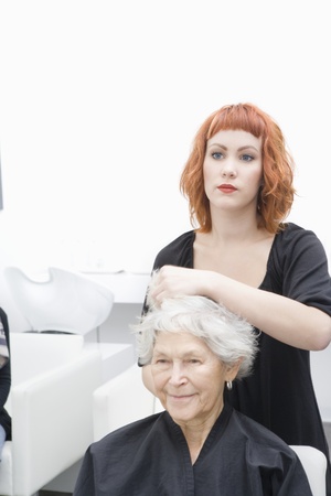 Stylist and client discuss haircutの写真素材
