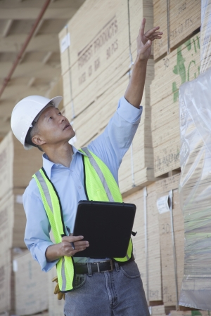 Warehouse worker taking inventoryの写真素材