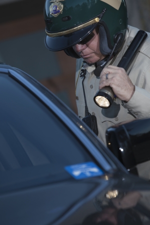 Nightwatch patrolman with flashlightの写真素材