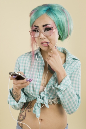 Portrait of a pensive woman listening to musicの写真素材