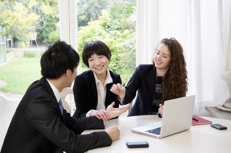Woman handing over keys to manの写真素材