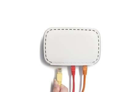 Female finger taking out USB wire from the switchの写真素材